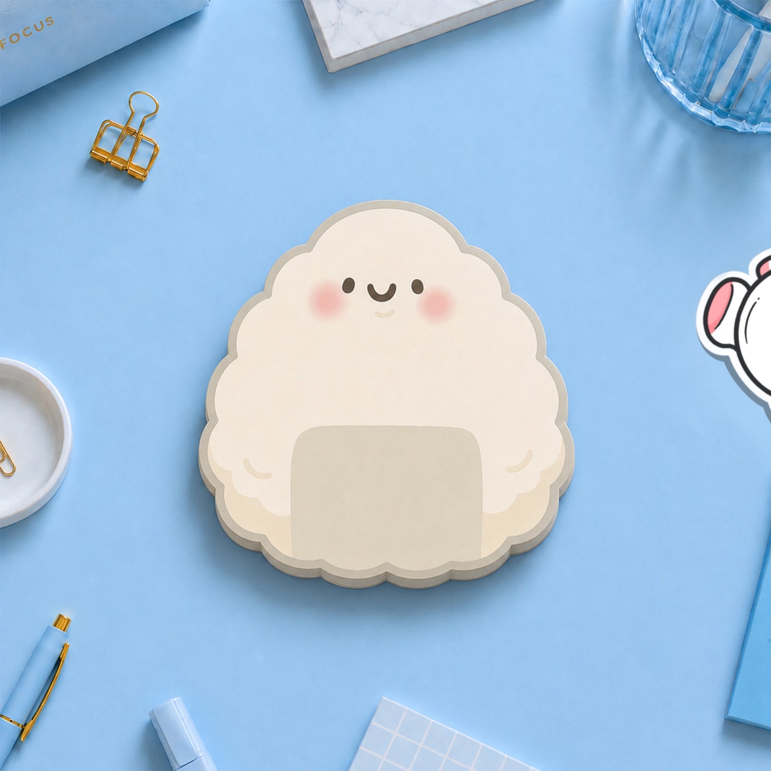 Onigri shaped Sushi sticky notes on blue desk