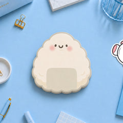 Onigri shaped Sushi sticky notes on blue desk