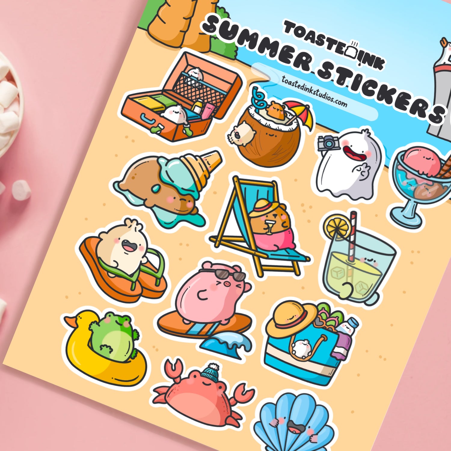 Summer sticker sheet on pink table with marshmallows