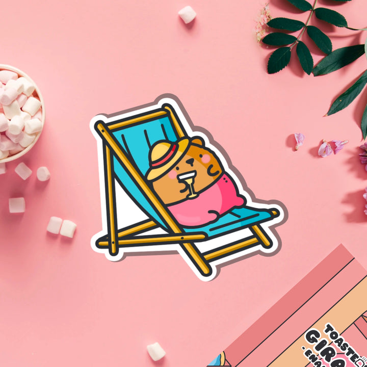 Bear sunbathing vinyl sticker on pink table