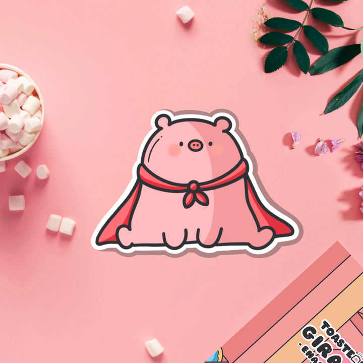 Super pig in red cape vinyl sticker on pink table