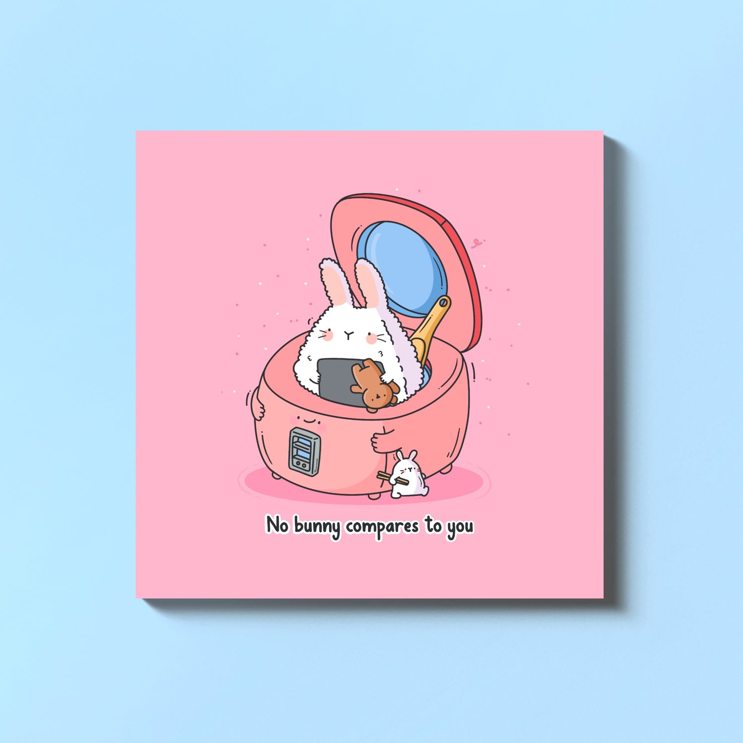 Sushi bunny in a rice cooker card on blue table