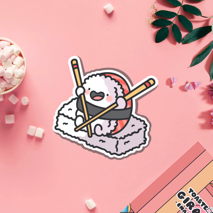 sushi holding chopsticks vinyl sticker on pink table