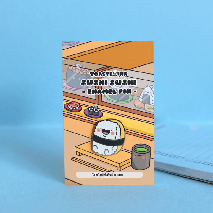 Sushi enamel pin on sushi bar backing card