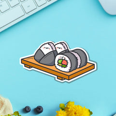Sushi plate vinyl sticker on blue table with keyboard