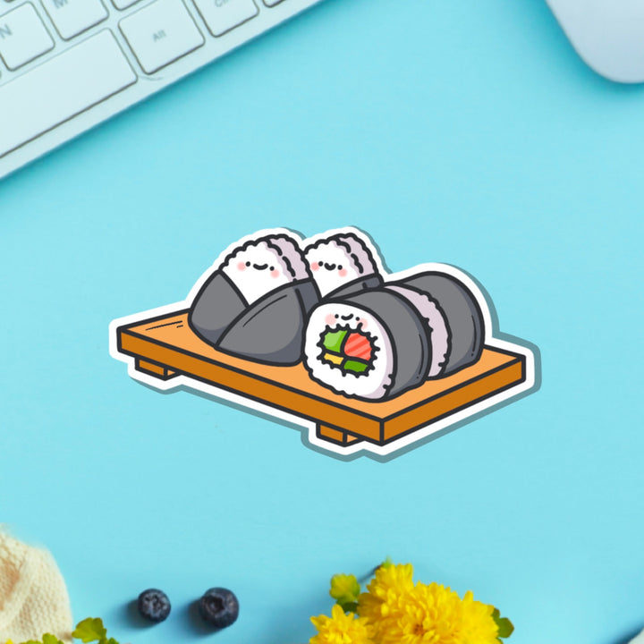 Sushi plate vinyl sticker on blue table with keyboard