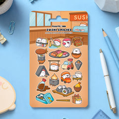 Sushi sticker sheet on blue table scattered with stationery
