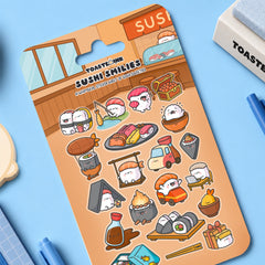 Sushi sticker sheet on blue table with stationery