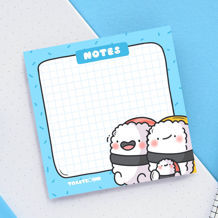 Sushi sticky notes on white and blue desk