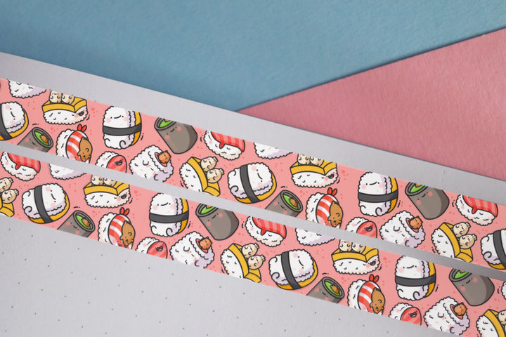 Sushi washi tape on blue and pink desk with notebook