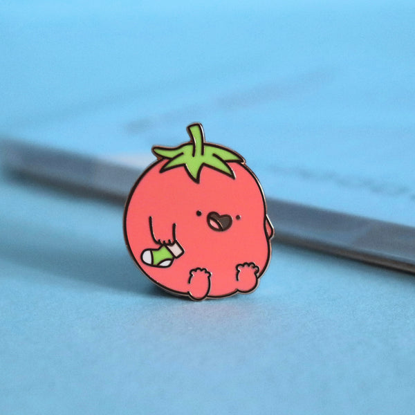 Tomatoes enamel pin on blue table