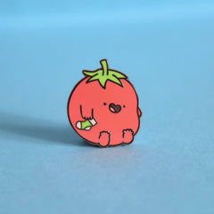 Tomatoes enamel pin on blue table