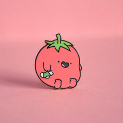 Tomato enamel pin on pink table