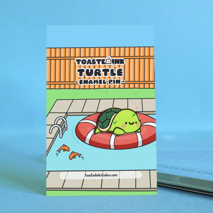 Turtle enamel pin on swimming pool backing card