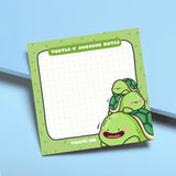 Turtle sticky notes on blue table