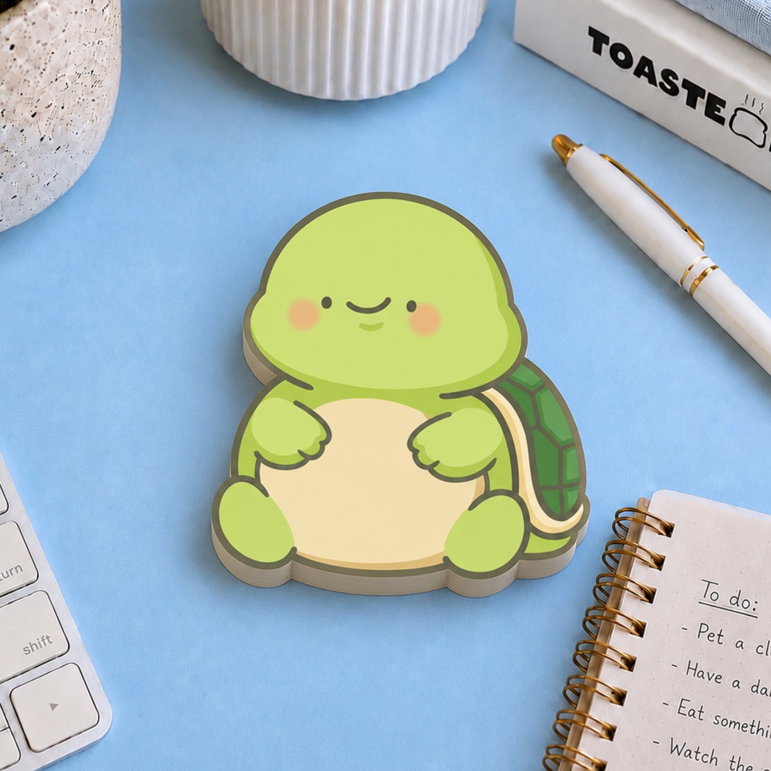 Turtle shaped sticky notes on desk with stationery