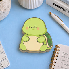 Turtle shaped sticky notes on desk with stationery