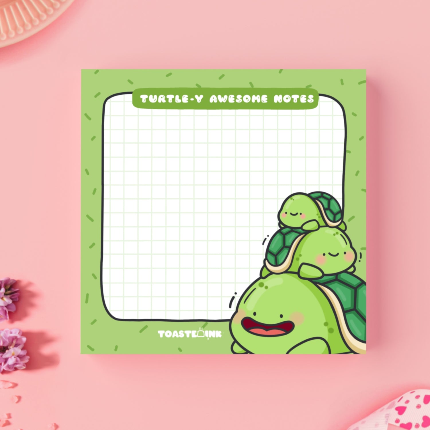 Turtle sticky notes on pink desk