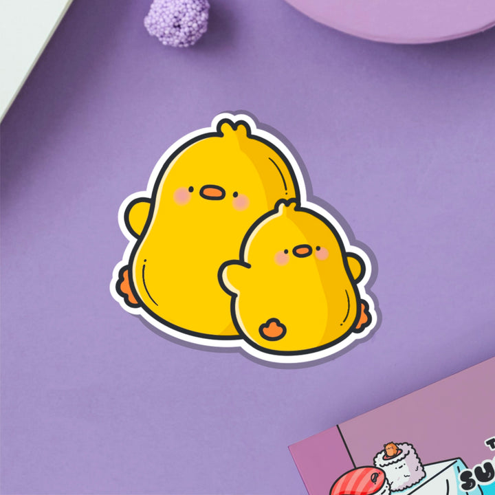 Two Chicks vinyl sticker on purple table