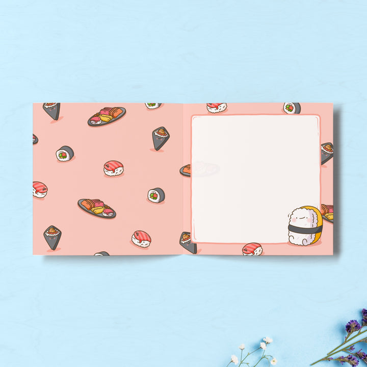 Sushi print inside card on blue table