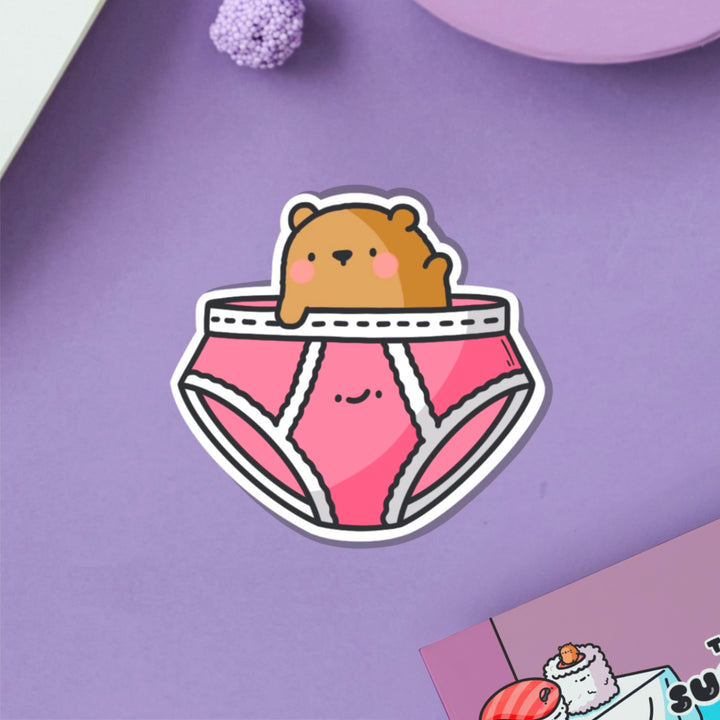 Bear in underwear vinyl sticker on purple table