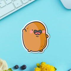 Waving potato vinyl sticker on green table