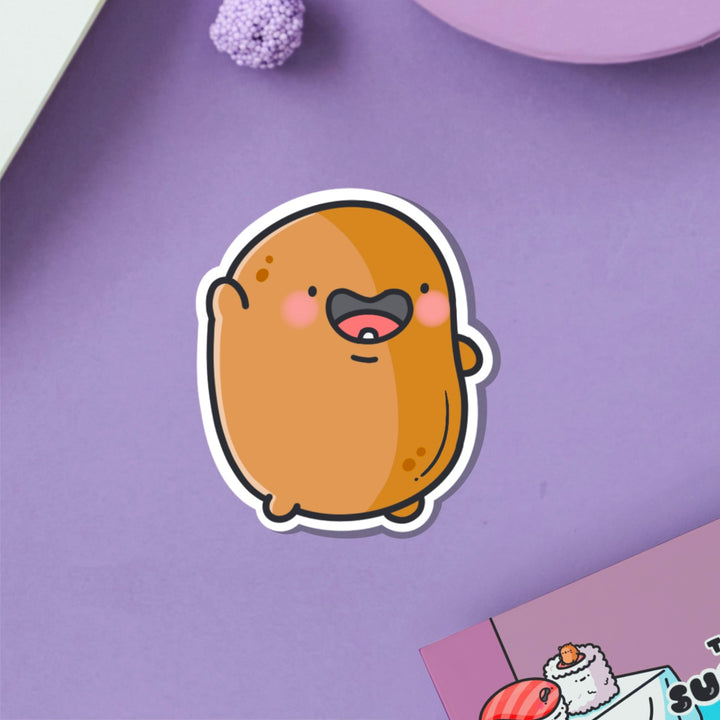 Waving potato vinyl sticker on purple table