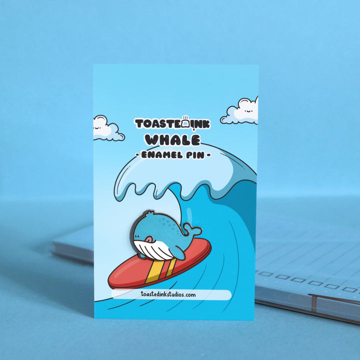 Whale enamel pin on surfing backing card