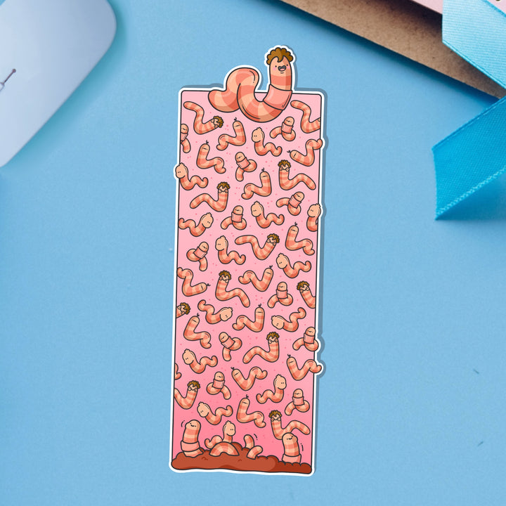 Worm bookmark on blue table