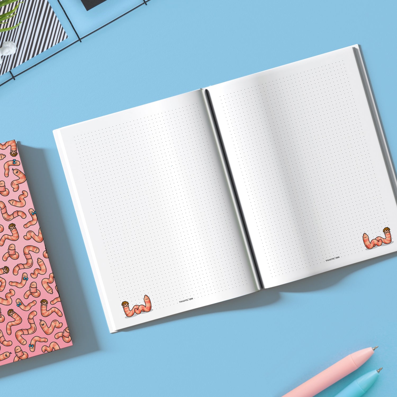 Open notebook with worm dot grid