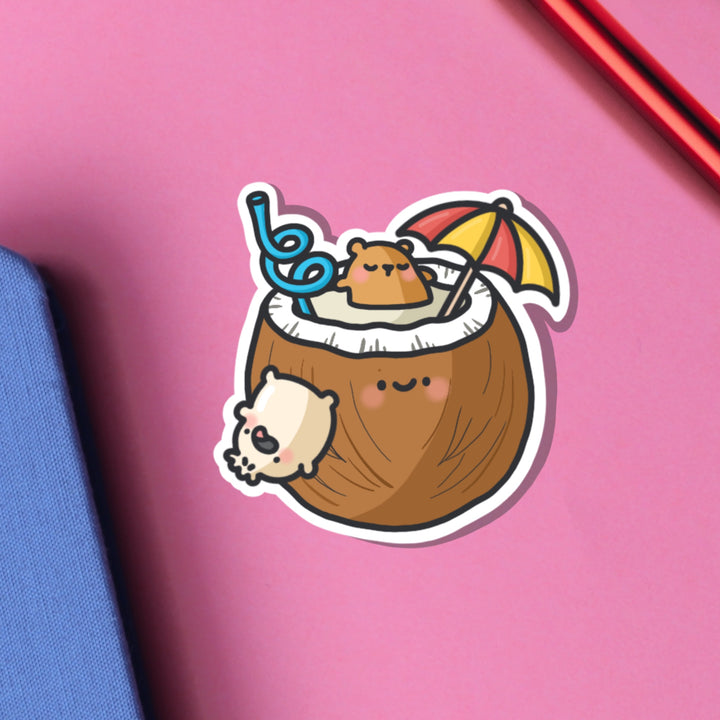 Bear bathing in coconut vinyl sticker on pink table
