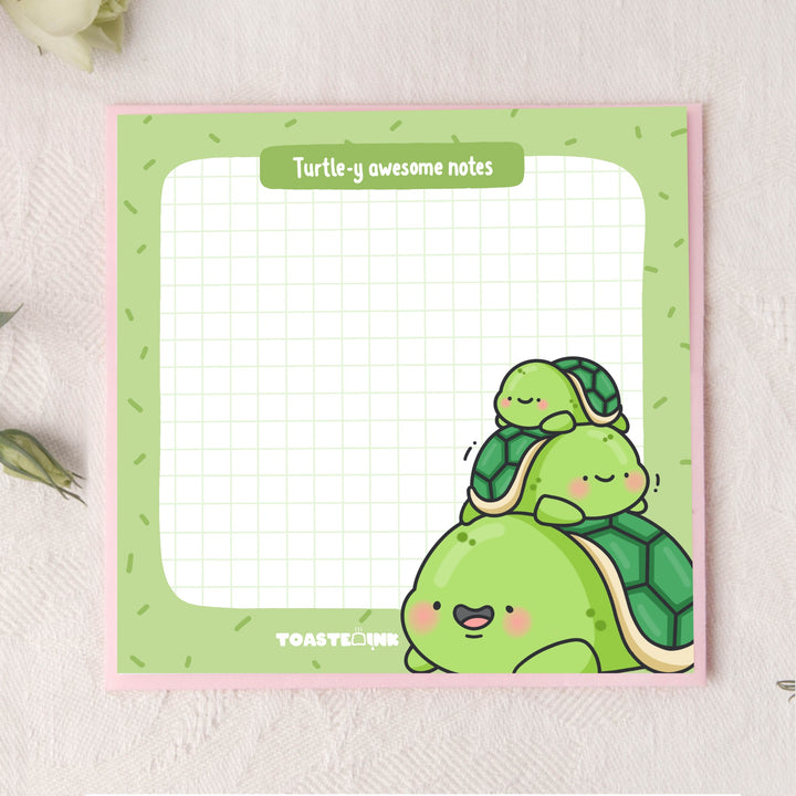 Turtle sticky notes on pink background