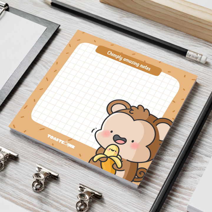 Cute monkey memo pad on grey table