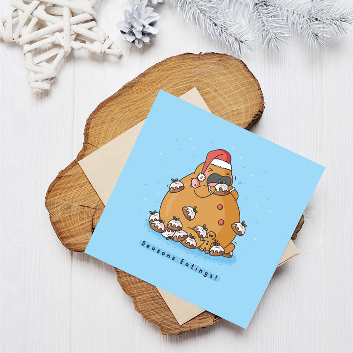 Christmas pudding card on wooden block