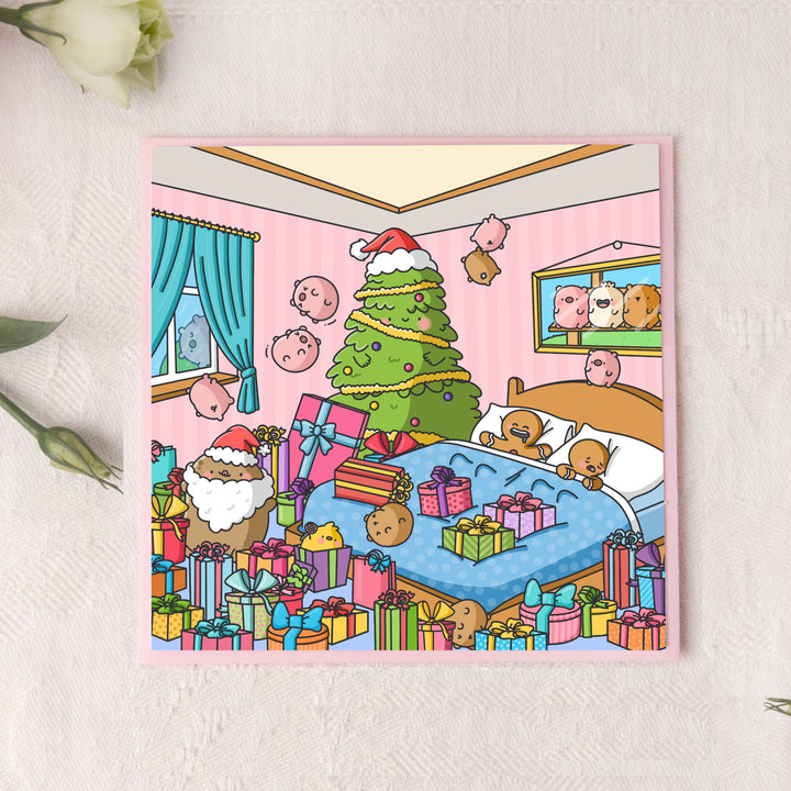 Cute Christmas presents card on pink table