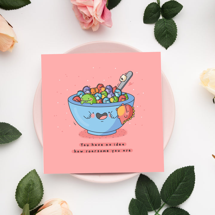 Bowl of dinosaurs card on pink plate