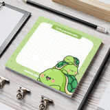 Turtle sticky notes on grey table