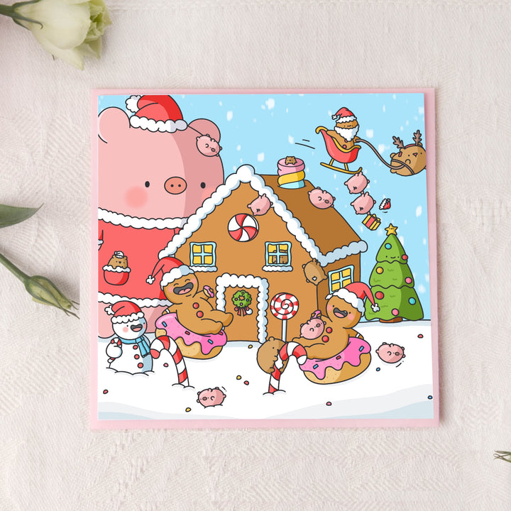 Christmas gingerbread man card on pink table