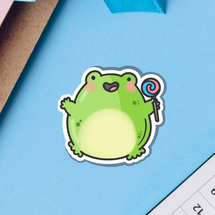 Jumping frog vinyl sticker on blue background