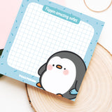 Penguin sticky notes on wooden block
