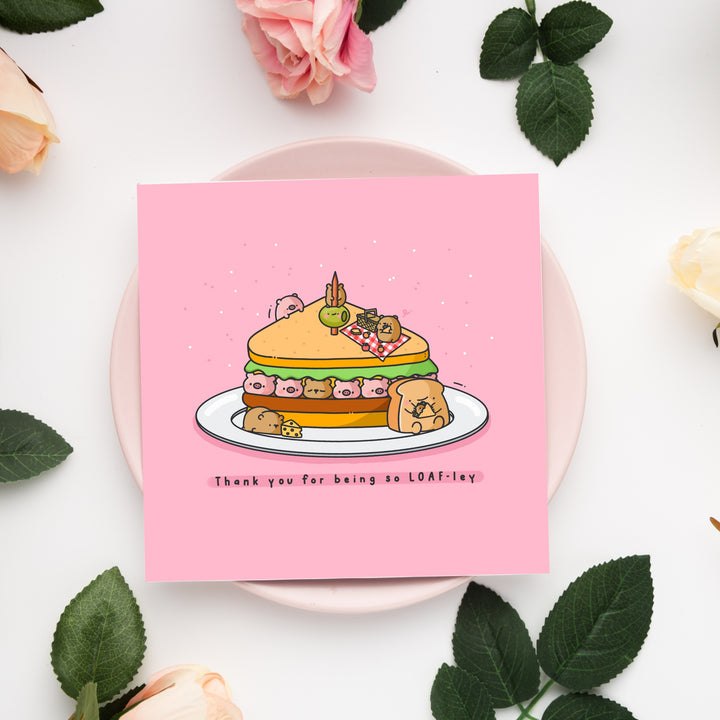 Sandwich card on pink plate