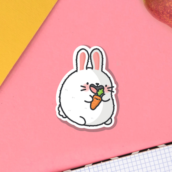 Bunny Rabbit vinyl sticker on pink table and notebook