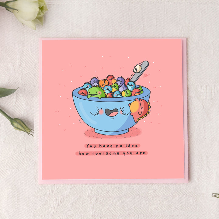 Dinosaur card on pink background