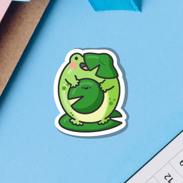 Frog on water lilies vinyl sticker on blue table