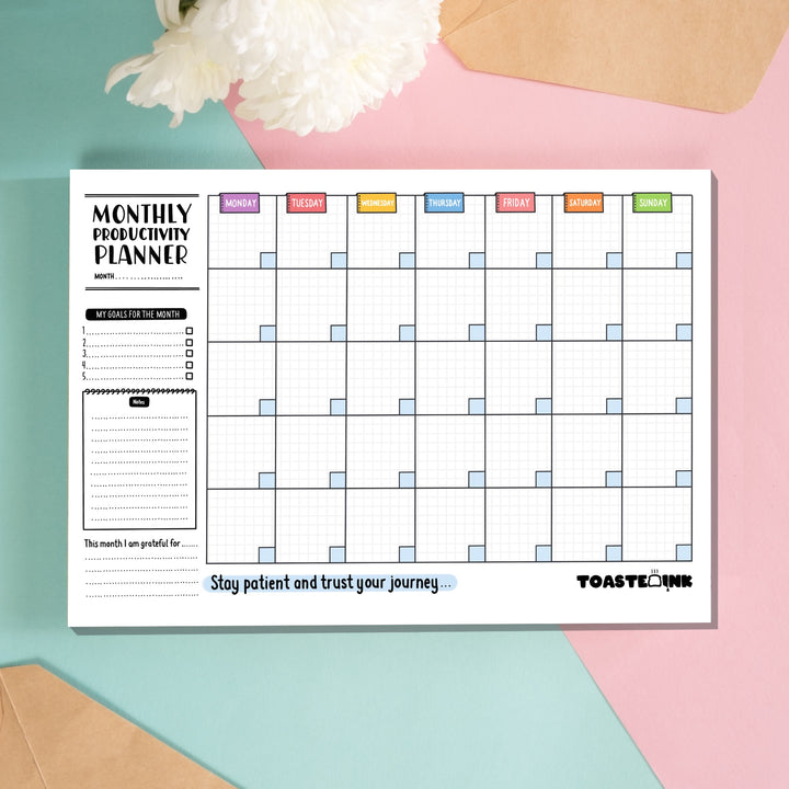 Monthly planner on pink and blue background