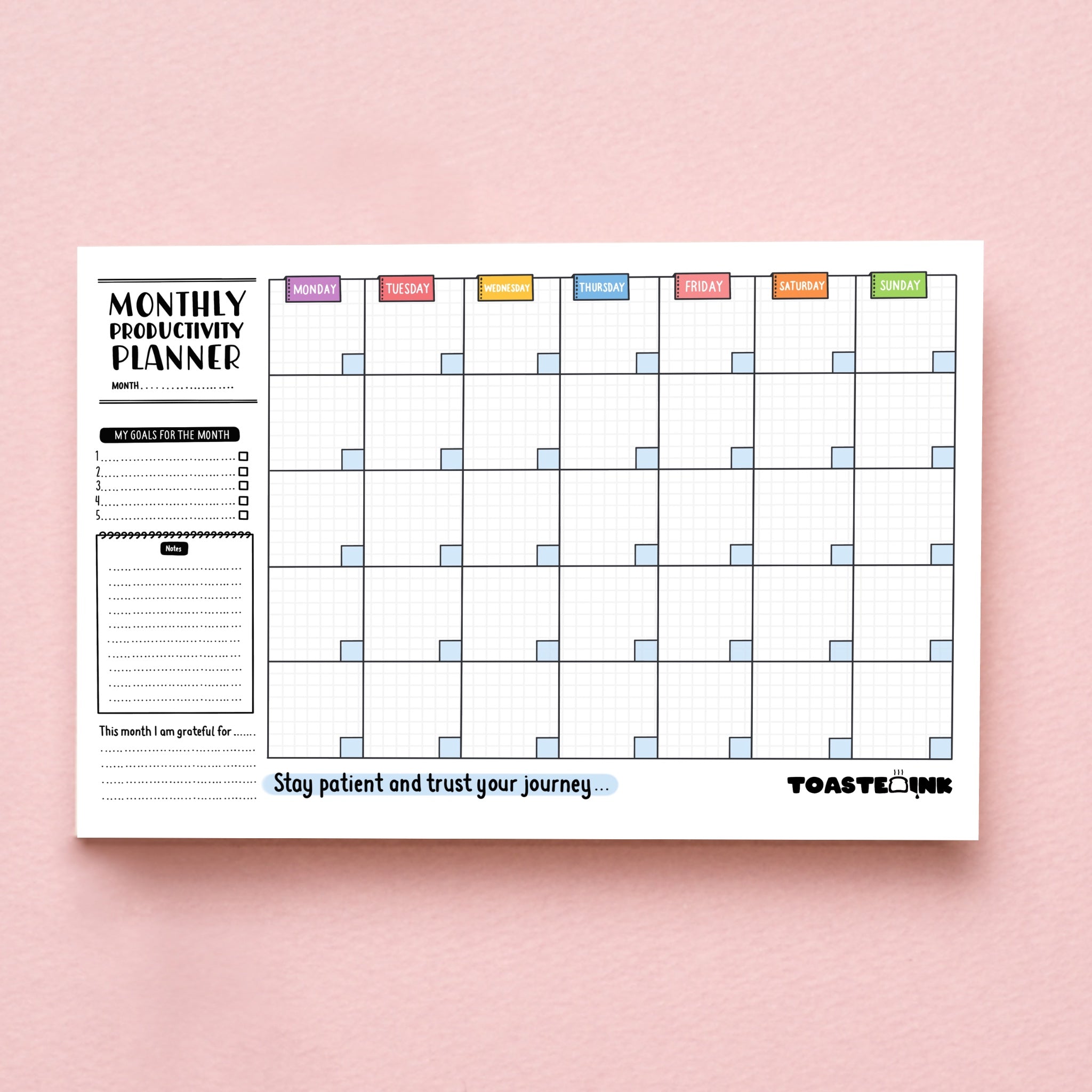Monthly planner on pink background