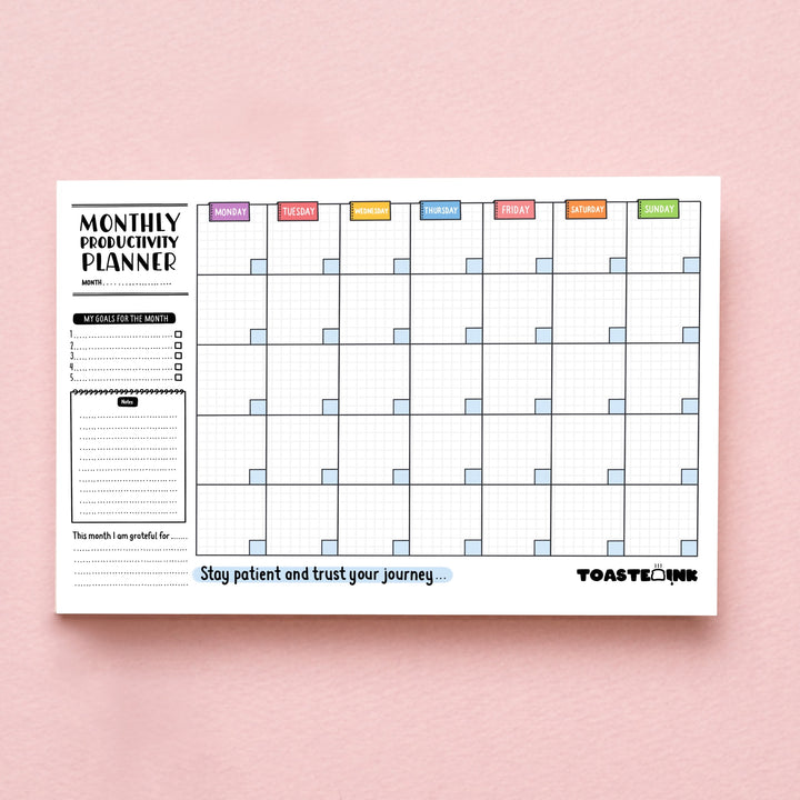 Monthly planner on pink background