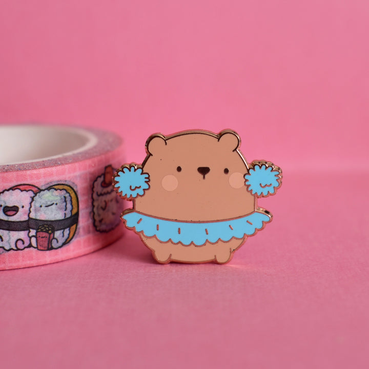 dancing bear enamel pin with washi tape on pink background