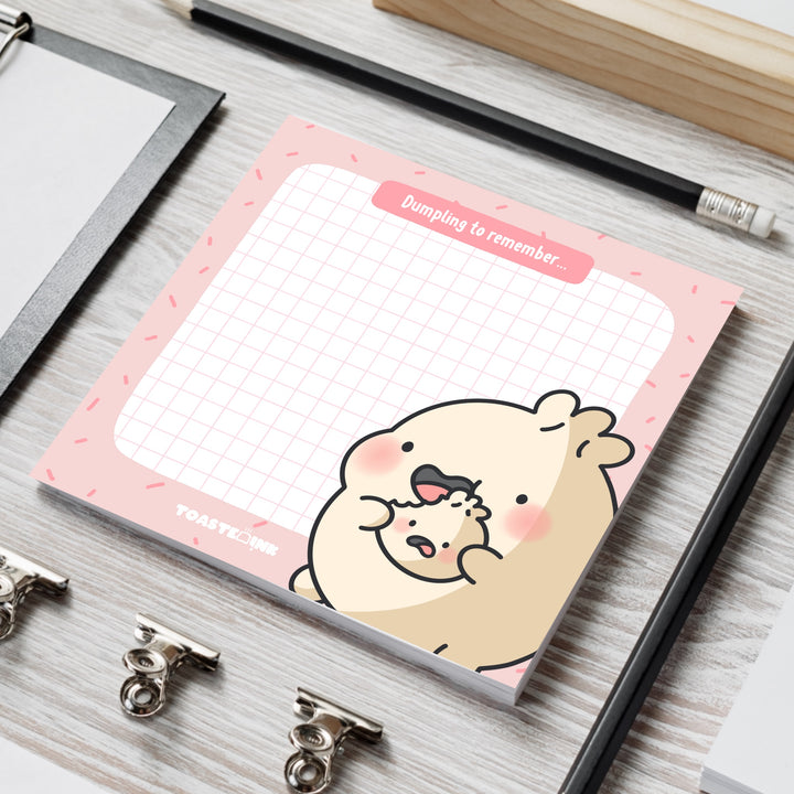 Cute dumpling sticky notes on grey table