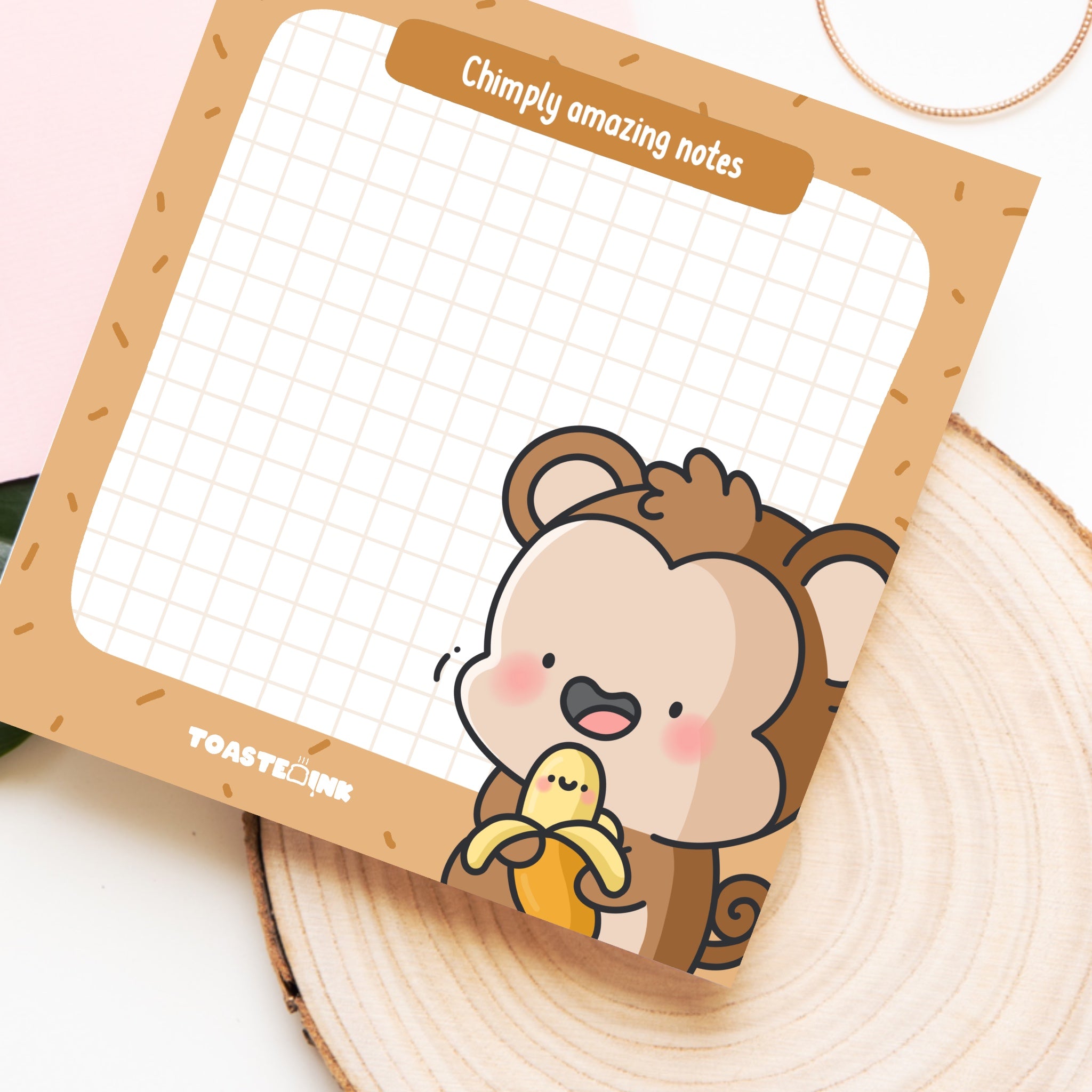 Cute monkey sticky notes on wooden block